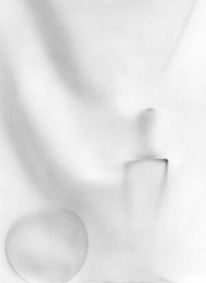 A blurry image of a white object in the air.