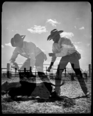 Two men in cowboy hats and a dog.