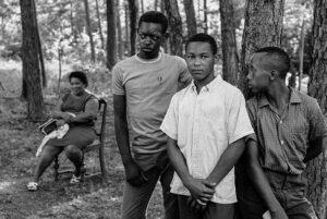 HERBERT RANDALL. Three teenagers and Addie Ruth at a fish fry hosted by Vernon Dahmer at his home in the Kelly Settlement outside of Hattiesburg, Mississippi,July 4, 1964.