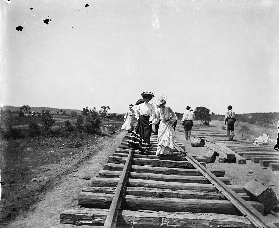JENNIE ROSS COBB. Friends walk along the Ozark and Cherokee Central Railroad under construction, Tahlequah, Oklahoma, 1902.