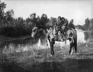 RICHARD THROSSEL. Two children on a horse, Apsáalooke Nation, c. 1905–11.