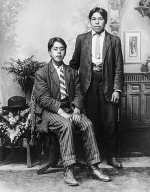 B.A. HALDANE. Two young men inside B. A. Haldane's photography studio, Metlakatla, Alaska, c. 1910